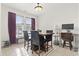 Inviting dining area with elegant furnishings, tile floors, and bright natural lighting at 157 Olde Towne Way # 4, Myrtle Beach, SC 29588