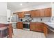 Well-equipped kitchen with stainless steel appliances, granite countertops, and wood cabinets at 157 Olde Towne Way # 4, Myrtle Beach, SC 29588