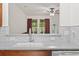 Kitchen view to living space featuring bright, natural light and modern finishes at 157 Olde Towne Way # 4, Myrtle Beach, SC 29588