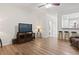 Living room featuring hardwood floors, tv, and access to kitchen at 157 Olde Towne Way # 4, Myrtle Beach, SC 29588