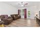 Spacious living room with hardwood floors, lots of light, and ceiling fan at 157 Olde Towne Way # 4, Myrtle Beach, SC 29588