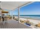 Spacious balcony offering stunning ocean views and a relaxing seating area at 1611A S Ocean Blvd., Surfside Beach, SC 29575