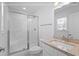 Bright bathroom featuring a shower, vanity, and neutral decor at 1611A S Ocean Blvd., Surfside Beach, SC 29575