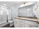 Well-lit bathroom with a shower and vanity at 1611A S Ocean Blvd., Surfside Beach, SC 29575
