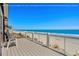 Gorgeous ocean views from this beachfront deck with wood railings, beach access, and relaxing seating at 1611A S Ocean Blvd., Surfside Beach, SC 29575
