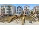 A view of the new beach home under construction between its neighboring homes at 1611A S Ocean Blvd., Surfside Beach, SC 29575
