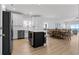 Bright kitchen featuring a large island with seating and stainless steel appliances at 1611A S Ocean Blvd., Surfside Beach, SC 29575