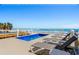 Inviting pool deck with lounge chairs, ocean view, and a private pool at 1611A S Ocean Blvd., Surfside Beach, SC 29575