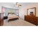 Cozy bedroom featuring a large window, soft carpet, and neutral paint at 189 Sea Turtle Dr., Myrtle Beach, SC 29588