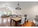 Open dining area with stylish lighting and view into the living room and kitchen at 189 Sea Turtle Dr., Myrtle Beach, SC 29588