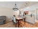 Open floor plan dining area featuring a modern chandelier and wood flooring at 189 Sea Turtle Dr., Myrtle Beach, SC 29588