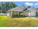 Inviting single-story home featuring a manicured lawn and covered front porch at 189 Sea Turtle Dr., Myrtle Beach, SC 29588