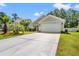 Exterior view of home with a large driveway and palm trees at 189 Sea Turtle Dr., Myrtle Beach, SC 29588