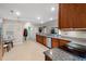Open kitchen with stainless steel appliances, granite counters, and adjacent breakfast area at 189 Sea Turtle Dr., Myrtle Beach, SC 29588