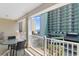 Relax on this sunny balcony with views of the neighborhood and the ocean in the distance at 200 53Rd Ave. N # 409, North Myrtle Beach, SC 29582