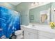 Bathroom with a white vanity, toilet, and a shower-tub combo with an ocean-themed curtain at 200 53Rd Ave. N # 409, North Myrtle Beach, SC 29582