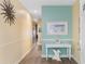 Charming entryway with soft colors, a decorative table, and wall art at 200 53Rd Ave. N # 409, North Myrtle Beach, SC 29582