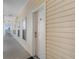 Exterior shot of unit 409, showcasing the hallway leading to the entrance door at 200 53Rd Ave. N # 409, North Myrtle Beach, SC 29582
