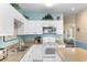Bright kitchen with white cabinets, granite counters, and stainless steel microwave at 200 53Rd Ave. N # 409, North Myrtle Beach, SC 29582