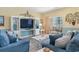 Comfortable living room with plush seating and a view of the outdoor balcony at 200 53Rd Ave. N # 409, North Myrtle Beach, SC 29582