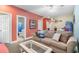 The living room has comfortable seating, an arcade game, and bathroom access at 200 53Rd Ave. N # 409, North Myrtle Beach, SC 29582