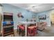 Cozy living room with an arcade game, card art, entertainment center, and comfortable seating at 200 53Rd Ave. N # 409, North Myrtle Beach, SC 29582