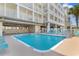 Enjoy this stunning community pool with lounge chairs for relaxing by the water at 200 53Rd Ave. N # 409, North Myrtle Beach, SC 29582