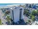 Aerial view of a building that showcases its architecture and surroundings including parking and local flora at 200 76Th Ave. N # 408, Myrtle Beach, SC 29572