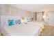 Inviting bedroom features two queen beds adorned with coastal decor and soft lighting creating a relaxing space at 200 76Th Ave. N # 408, Myrtle Beach, SC 29572