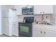 Well-lit kitchen with white cabinetry, stainless steel appliances, and a classic design at 200 76Th Ave. N # 408, Myrtle Beach, SC 29572