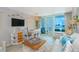 Bright living room with ocean view, stylish decor and balcony access at 200 76Th Ave. N # 408, Myrtle Beach, SC 29572