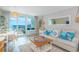 Open-concept living room with ocean views, stylish furniture, and natural light at 200 76Th Ave. N # 408, Myrtle Beach, SC 29572
