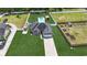 Aerial view of the property showcasing the landscaped yard, pool, and proximity to surrounding homes at 210 Fox Hunt Pl., Aynor, SC 29511
