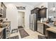 Well-equipped kitchen with dark cabinets, stainless steel appliances, and tile flooring at 210 Fox Hunt Pl., Aynor, SC 29511