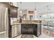 Kitchen with granite countertops, stainless steel appliances, and an open view of the dining area at 210 Fox Hunt Pl., Aynor, SC 29511