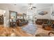 Bright living room featuring hardwood floors, ceiling fan, and comfortable couches at 210 Fox Hunt Pl., Aynor, SC 29511