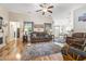 Cozy living room with hardwood floors, ceiling fan, and comfortable seating at 210 Fox Hunt Pl., Aynor, SC 29511