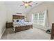 Inviting bedroom with vaulted ceiling, ceiling fan, and a cozy nautical-themed decor at 210 Fox Hunt Pl., Aynor, SC 29511