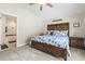 Spacious bedroom featuring carpet flooring, a nautical theme, and ensuite bath access at 210 Fox Hunt Pl., Aynor, SC 29511