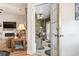 Bright sunroom featuring wicker furniture, tiled floors, and charming seaside decor at 210 Fox Hunt Pl., Aynor, SC 29511