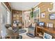 Inviting sunroom with wood paneled walls and decorative accents at 210 Fox Hunt Pl., Aynor, SC 29511