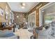 Cozy sunroom with wicker furniture and nautical decorations at 210 Fox Hunt Pl., Aynor, SC 29511