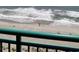 Scenic view of a sandy beach with waves crashing along the shore, as seen from a balcony at 2207 S Ocean Blvd. # 1407, Myrtle Beach, SC 29577
