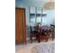 Charming dining area with a wooden table, chairs, and decorative wall art, creating a cozy and inviting space at 2207 S Ocean Blvd. # 1407, Myrtle Beach, SC 29577