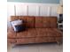 Cozy living area featuring a comfortable sofa with decorative pillows, creating a welcoming and relaxed atmosphere at 2207 S Ocean Blvd. # 1407, Myrtle Beach, SC 29577