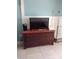 Living area featuring a flat-screen TV on a wooden cabinet with ample drawer space at 2207 S Ocean Blvd. # 1407, Myrtle Beach, SC 29577