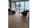 Relaxing lobby with rattan chairs facing a large window showcasing ocean views at 2207 S Ocean Blvd. # 1407, Myrtle Beach, SC 29577