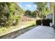 Backyard featuring lush greenery, planter boxes and a concrete patio area at 2409 Thoroughfare Dr. # 2409, North Myrtle Beach, SC 29582
