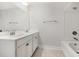 Clean bathroom with double sinks, white cabinets and tile, and a shower-tub combo for a crisp design at 2409 Thoroughfare Dr. # 2409, North Myrtle Beach, SC 29582