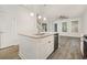 Modern kitchen island with granite countertops, stainless steel appliances, and gray flooring at 2409 Thoroughfare Dr. # 2409, North Myrtle Beach, SC 29582